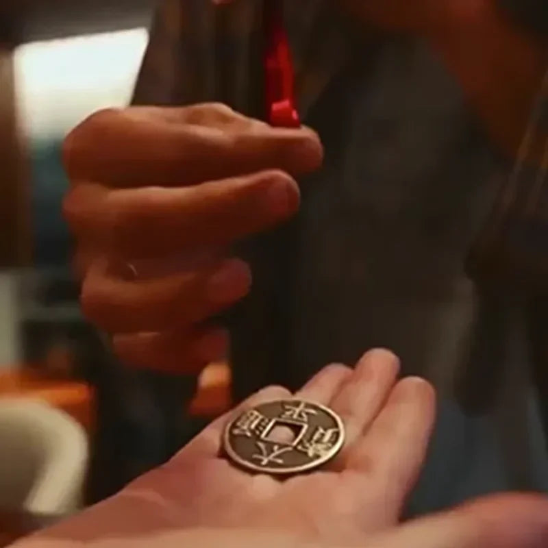 The Challenge by Mari & Paco Lopez Magic Tricks Coin Melts Thru Ribbon